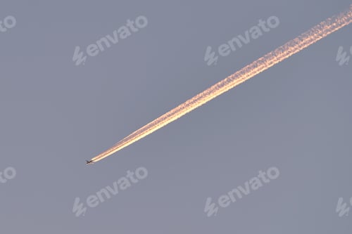 Preview: Distant passenger jet plane flying on high altitude on clear blue sky
