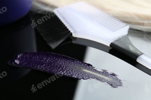 Preview: Hair care cosmetic product for blonde hair and brush on mirror surface, closeup