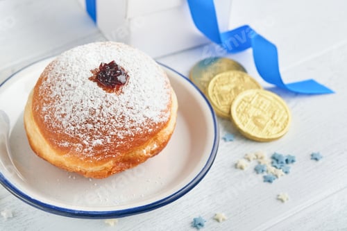 Preview: Happy Hanukkah. Hanukkah sweet doughnuts, gift boxes, white candles and chocolate coins on white woo