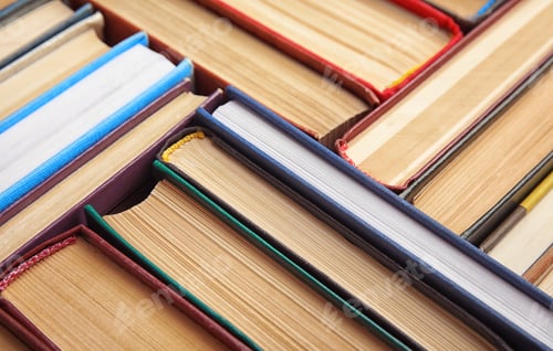 Preview: Many different hardcover books as background, closeup