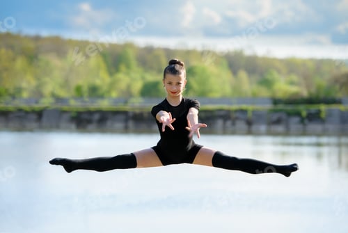 Preview: Young Gymnast is Up in the Air Doing Leg-Split