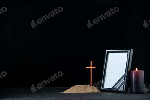 Preview: front view of little grave with candle and picture frame on dark background funeral israel death