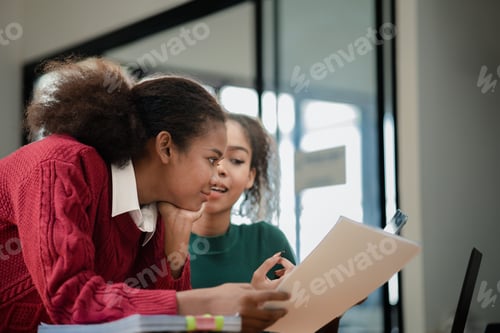Preview: Two American women are working together in the office of a startup company. They are having a brains