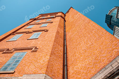 Preview: Low angle of a brick building against the blue sky in Wuhan, China