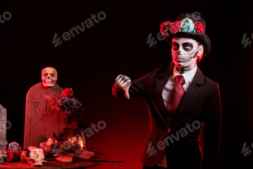Preview: Disappointed mysterious lady doing negative hand gesture during Halloween