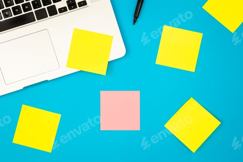 Preview: Laptop computer with many sticky notes on a blue background, flat lay.