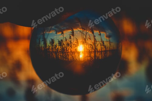 Preview: Beautiful sunrise upside-down view from a crystal ball perspective