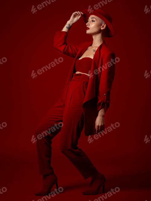 Preview: Art, fashion and a model woman on a red studio background for elegant or trendy style. Aesthetic, b