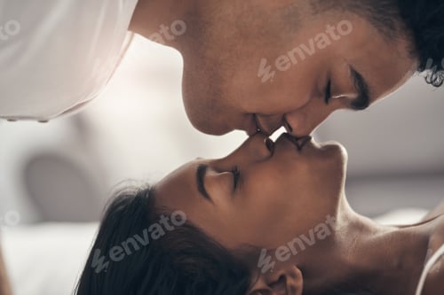 Preview: Love is kind. Shot of a young couple sharing an intimate moment at home.