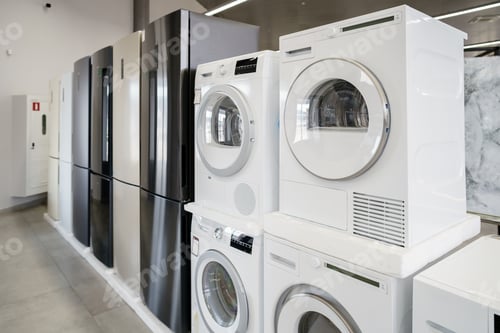 Preview: Row of new washing machines in a hypermarket