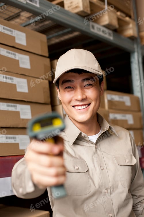 Preview: Male Chinese warehouse worker with scanner