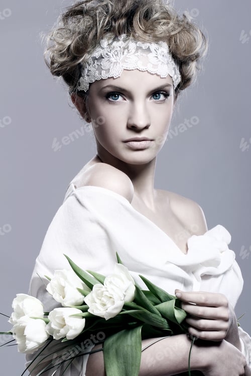Preview: Beautiful young woman with white tulips