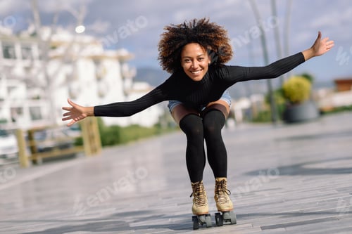 Preview: Black woman on roller skates riding outdoors on urban street