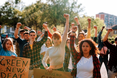 Preview: young crowd in protest demonstration - group of activists in march with raised fist