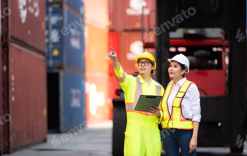 Preview: Portrait of Asian woman engineer and worker working with co-worker at overseas shipping container
