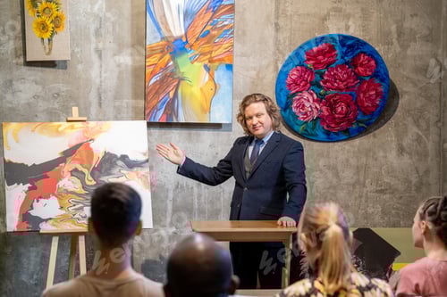 Preview: Painter presenting his paintings to the audience