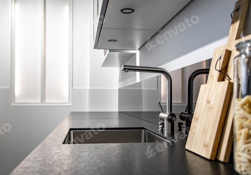 Preview: New modern steel faucet and kitchen room sink close up.