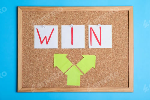 Preview: Cork board with notes forming word Win on color background. Victory concept