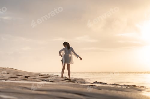 Preview: Woman at Sunset on the Beach