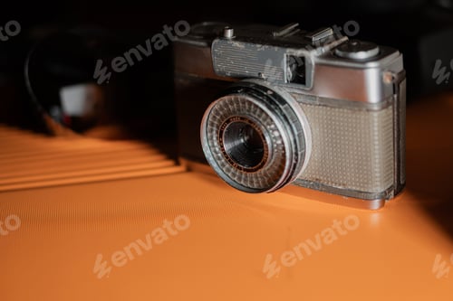 Preview: Vintage Camera on Orange Surface