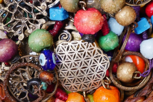 Preview: Colorful assortment of jewelry beads and charms in sunlight