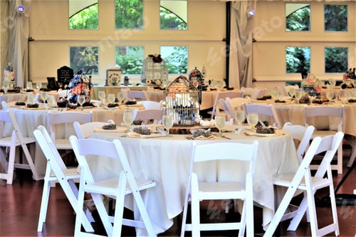 Preview: Wedding Reception Tables with Birdcage Centerpieces and White Linens