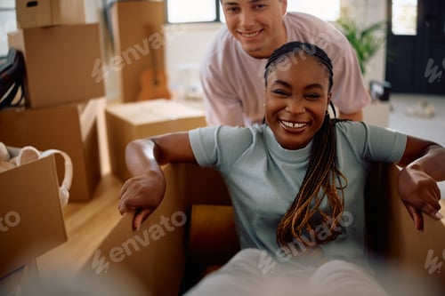 Preview: Cheerful black woman and her boyfriend having fun while moving into new apartment.