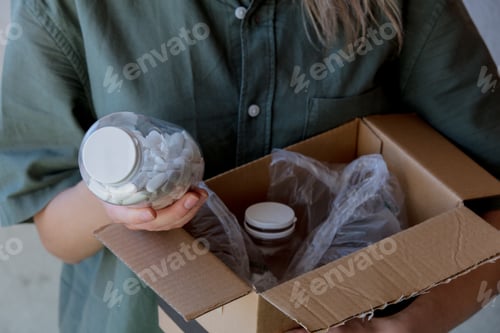 Preview: woman pulls a jar of pills out of the box
