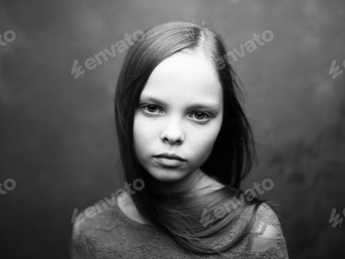 Preview: Beautiful little girl portrait close-up cropped view in dark background model