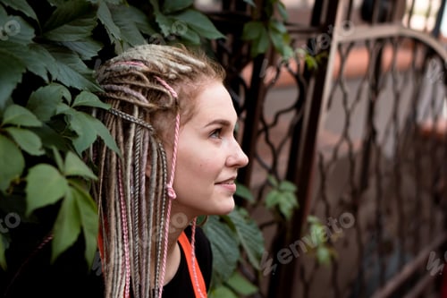 Preview: beautiful young woman with dreadlocks