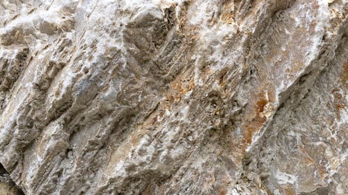 Preview: Multicolored vertical rock surface in Alps. Filled frame. Background 16x9 Screensaver for webinar