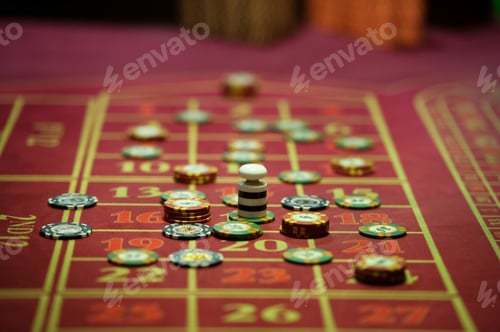 Preview: close-up of casino chips on the red table