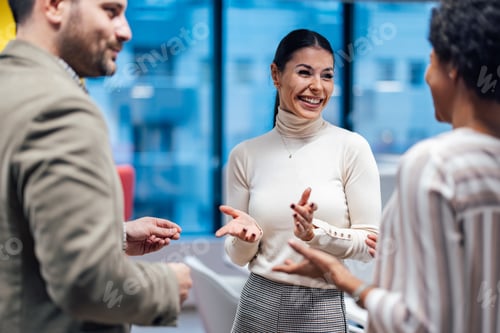 Preview: Two experienced colleagues, meeting a new employee in the office.
