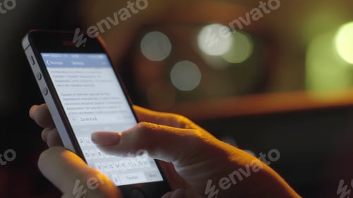 Preview: Close up of a woman typing on mobile phone. Girl's hand holding a modern smartphone and pointing