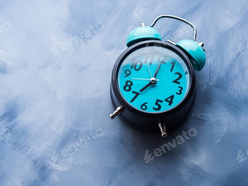 Preview: Blue alarm clock on abstract background