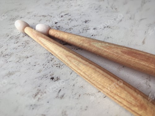 Preview: Wooden Drum Sticks on Mottled White Surface