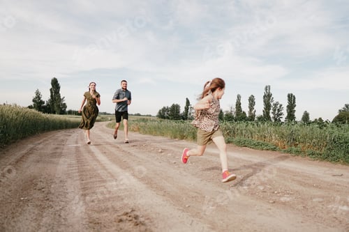 Preview: little girl running with mom and dad