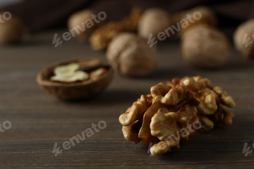 Preview: Walnuts with kitchen towel on wooden background