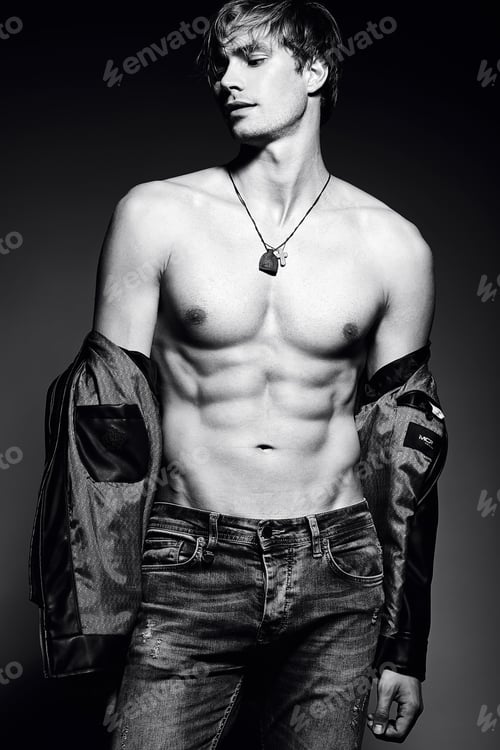 Preview: Portrait of young handsome man posing in studio