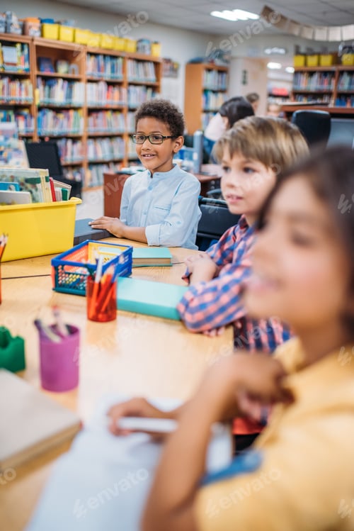 Preview: adorable little kids having lesson in library
