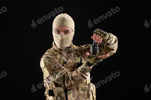 Preview: front view young soldier in uniform with grenade on black background warrior tank