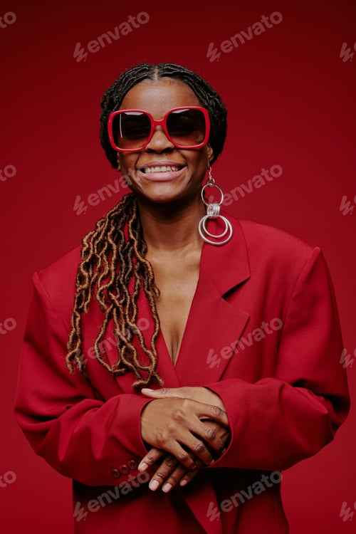 Preview: Portrait of Smiling Woman Wearing Red Sunglasses and Earrings