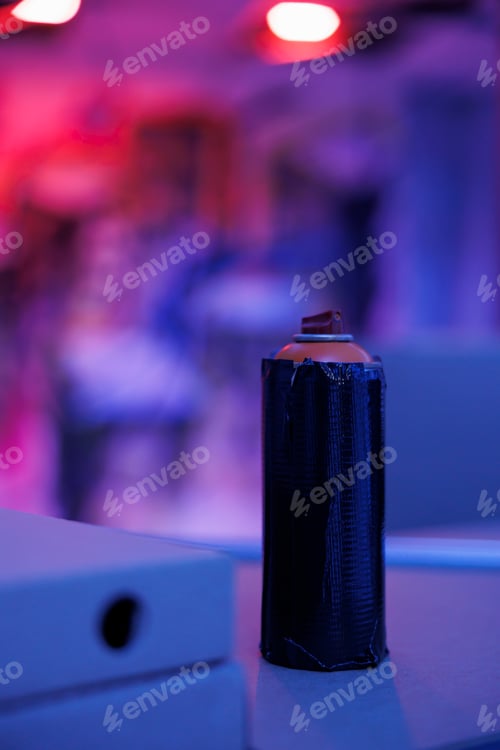 Preview: Graffiti spray paint bottles glowing under neon lights