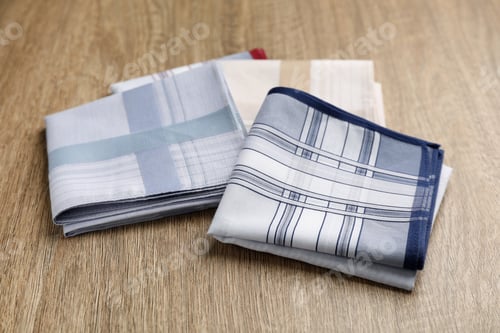 Preview: New handkerchiefs on wooden table. Stylish accessory