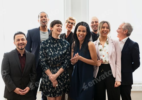 Preview: Happy business people standing together