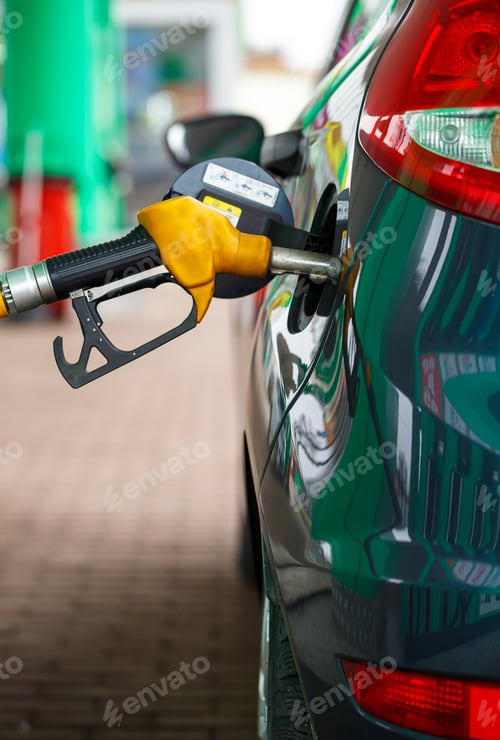 Preview: Car refueling on a petrol station close up