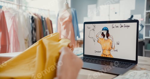 Preview: Asia lady dressmaker with laptop on graphic sketch photo use tape measure fabric compare.