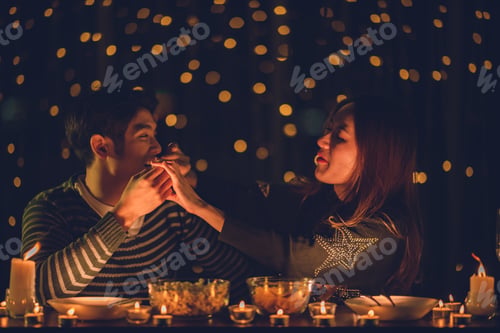 Preview: couple celebration concept, Christmas or new year party with romantic night light, home winter happy