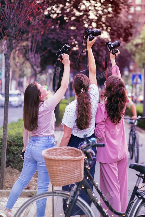 Preview: Three young women photographers being happy
