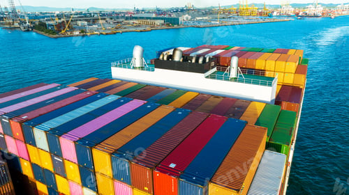 Preview: Stern of large cargo ship import export container box on the ocean sea on blue sky back ground